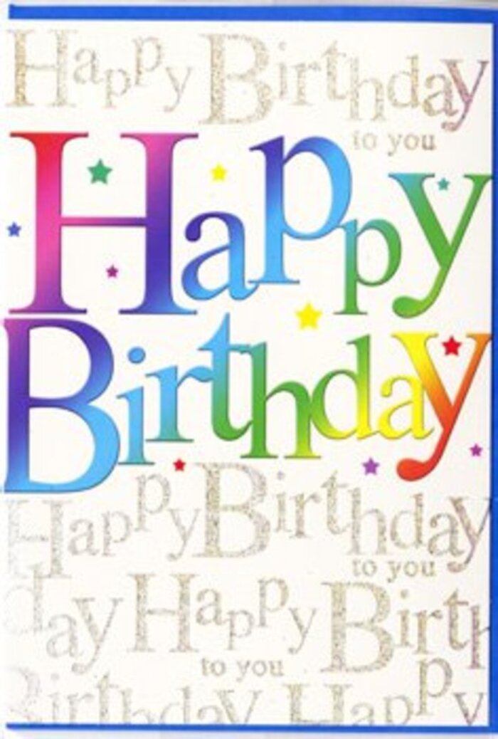 The birthday card shown in the image is a joyful, contemporary design, perfectly suited to slip alongside a bouquet arriving from a local Dartmouth Park florist. Dominating the front are the words Happy Birthday, written in chunky, clean-cut capitals that stretch confidently across the card. Each letter is drenched in a different, saturated colour, moving in a smooth rainbow sequence from deep red at one end through coral, golden yellow, grassy green, turquoise, azure blue, indigo, and violet at the other, creating an effect reminiscent of colourful balloons or streamers dancing over the park on a breezy day. The colours are carefully blended so that no edge feels abrupt; instead, they melt gently into each other, lending the card a harmonious, almost musical rhythm. Behind this bold message, a field of tiny golden handwriting quietly repeats Happy Birthday to you from top to bottom. The script is delicate and looping, like a note jotted by hand, and finished with a fine metallic shimmer that reflects light in a soft, candle-like way rather than a harsh glitter. This repeating phrase gives the impression of a chorus of friends gathered along Chester Road, all singing together in the background while the main greeting takes centre stage. Small, confetti-style stars and dots in coordinating rainbow shades float around the lettering, adding little sparks of excitement and movement. The card surface appears smooth and refined, likely with a semi-gloss coating that makes the colours feel even more luminous. The overall mood is upbeat yet tasteful, a design that conveys genuine, uncomplicated celebration-just right to accompany birthday flowers delivered across Dartmouth Park, Tufnell Park, or nearby Highgate.