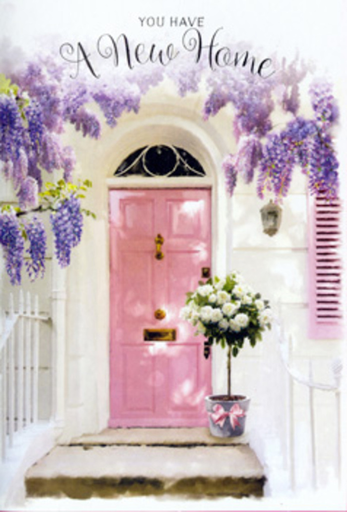 This Dartmouth Park doorway scene feels like the moment just before you turn the key at a new address and take a steadying breath. A gently painted pink front door, its shade soft and comforting, stands in the middle of smooth whitewashed walls that glow with reflected light, much like the calm brightness of a clear morning near Hampstead Heath. The windows are framed with matching pastel shutters, their quiet blush hue echoing the door and creating a seamless, curated façade. Above, wisteria tumbles in abundant lavender streams, clusters of blossoms spilling down in layered curtains that soften every hard edge of brick and plaster. The flowers hang low and loose, as if they've grown specifically to shelter this doorway, adding a whisper of fragrance and an almost storybook quality to the entrance. At the foot of the door, a metal florist's bucket in gentle grey has been filled to overflowing with sumptuous white and cream roses, each bloom opened to a full rosette, their petals thick, velvety, and almost luminous against the neutral container. Sprigs of fresh greenery weave through the arrangement, adding texture and depth, a reminder of the green corners sprinkled around Dartmouth Park and the nearby heath. A single pink ribbon is tied around the base of the bucket, its satin surface catching the light in soft highlights and linking visually back to the pink door behind it. The warm, filtered sunlight falls across the steps, creating subtle, painterly shadows that make the scene feel tranquil and filled with promise. It's the kind of new home floral moment a local Dartmouth Park florist might create when asked to deliver congratulations, comfort, and a gentle sense of welcome all in one graceful arrangement.