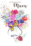 This Mother's Day card artwork shows a jubilant watercolour bouquet, as though someone captured the feeling of walking past the blooming gardens around Dartmouth Park in a single, fluid sketch. The flowers rise from a softly curved vase, their stems implied rather than sharply drawn, creating an airy, dreamlike arrangement. Lush purples, buoyant pinks, serene blues, and bright reds mingle freely, with each flower edged or accented by deep indigo lines that provide definition while still feeling loose and painterly. Small touches of shimmering gold highlight certain petals and leaves, adding a whisper of luxury, like the glint of ribbon on a freshly wrapped bouquet ready to be delivered to a townhouse near York Rise or a flat overlooking the park. Around the central cluster, fine paint flicks and scattered droplets of colour radiate outward, giving the impression of petals tossed in celebration or confetti caught mid-air. Some of these marks form gentle heart-like shapes, reinforcing the card's message of affection and gratitude. The vase at the base is finished with a tidy golden bow, its neat loops suggesting the careful hands of someone who loves both flowers and the person receiving them. The entire composition feels light yet emotionally full, a blend of joyful spontaneity and thoughtful intention. It seems perfectly suited to accompany a fresh bouquet from Flower Delivery Dartmouth Park, or to stand alone as a lasting tribute, carrying all the warmth, tenderness, and quiet pride of Mother's Day for families spread across Dartmouth Park and the nearby corners of North London.